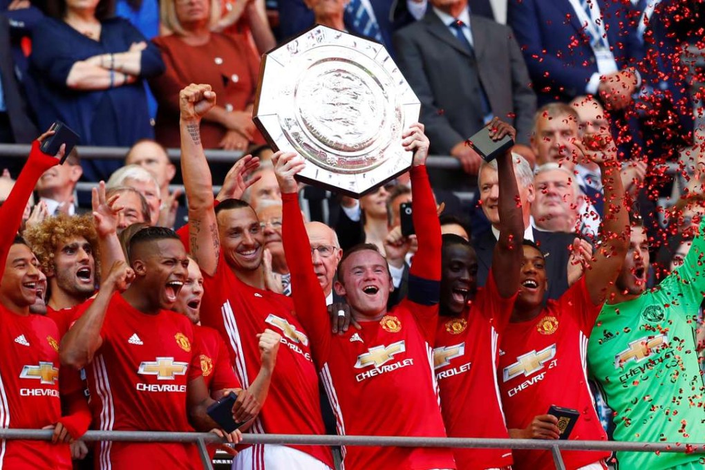 Manchester United captain Wayne Rooney celebrates with the Community Shield after the 2-1 win over Leicester City. Photo: Reuters