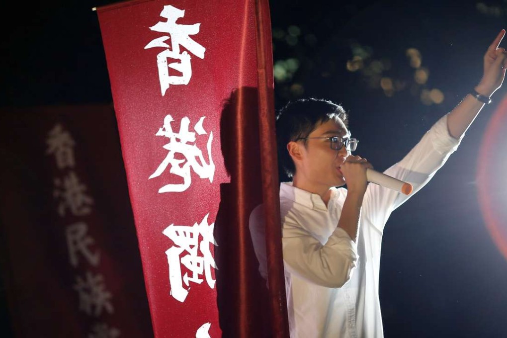 Hong Kong National Party convenor Chan Ho-tin speaks during a rally to protest against the disqualification of his application to run in the Legislative Council election. Photo: Reuters