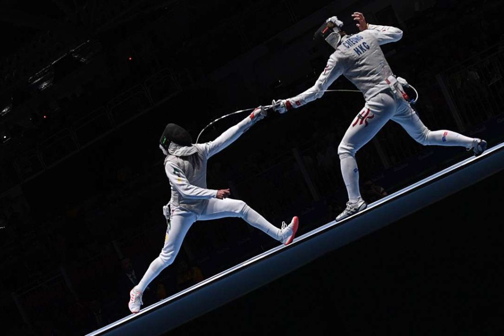 Hong Kong's Cheung Ka Long (R) competes against Brazil's Guilherme Toldo AFP PHOTO / Kirill KUDRYAVTSEV