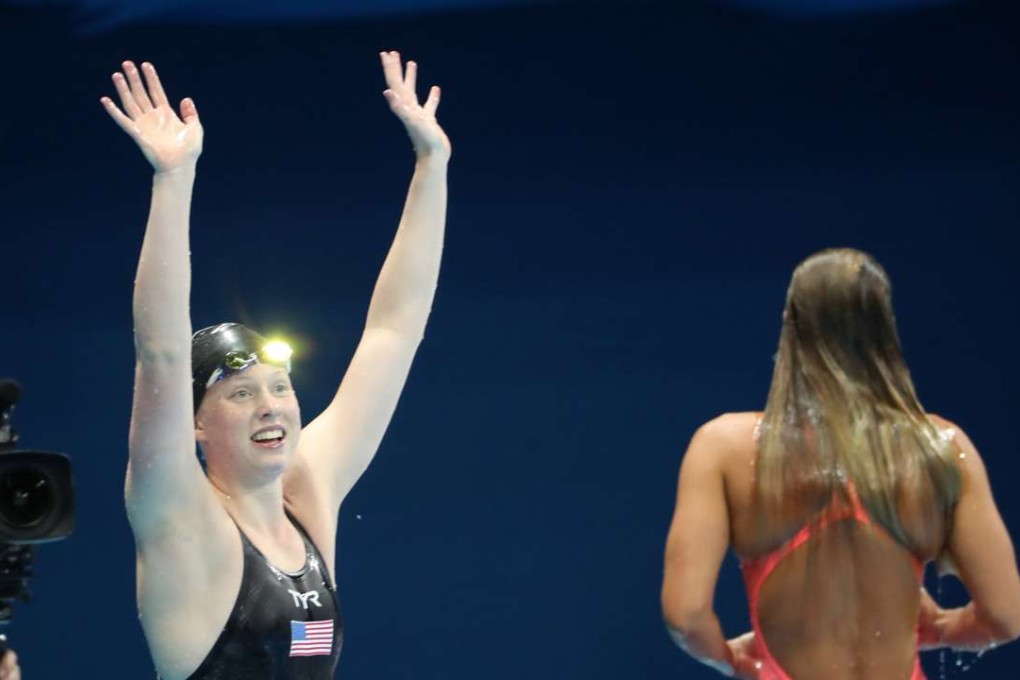 Lilly King of the United States waves to the crowd after winning the gold medal in the 100 metre breaststroke, beating Russia’s drug-tainted Yuia Efimova. Photo: TNS