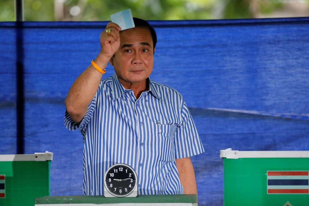 Thailand’s Prime Minister Prayuth Chan-ocha casts his ballot at a polling station during a constitutional referendum vote in Bangkok. Photo: Reuters