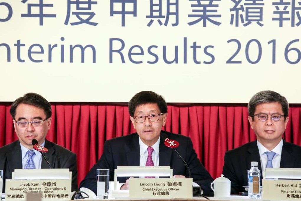 From left, Jacob Kam Chak-pui, managing director (operation and mainland business), Lincoln Leong Kwok-kuen, chief executive officer, and Herbert Hui Leung-wah, finance director of MTR Corporation, attend a press briefing to announce half year results on Tuesday. Photo: Jonathan Wong