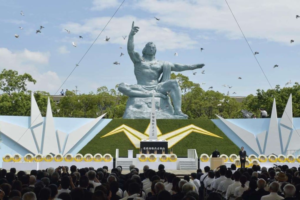 Doves are released into the air around the Peace Statue at Nagasaki Peace Park in Nagasaki, during a ceremony to mark the 71st anniversary of the US atomic bombing of the city. Photo: Kyodo