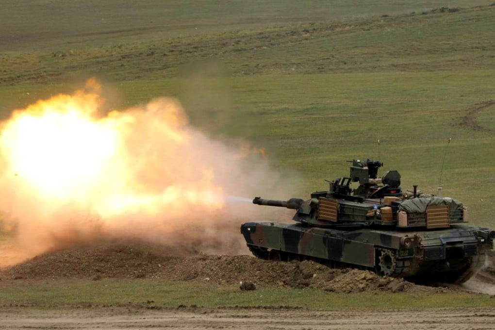 A US Abrams tank fires during a US led joint military exercise near Vaziani, Georgia. Photo: Reuters