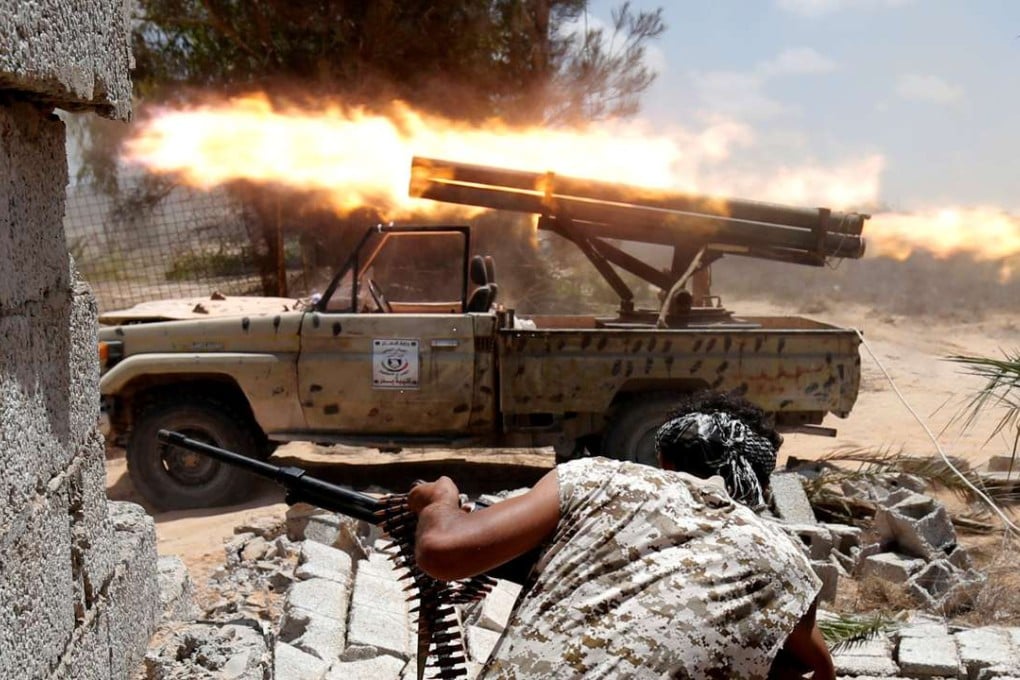 Libyan militants allied with the UN-backed government battle IS fighters in Sirte. Photo: Reuters