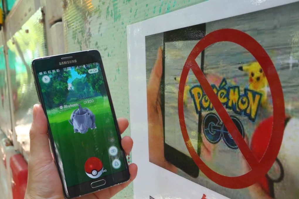 A warning sign for Pokemon Go players at Victoria Park in Causeway Bay. Photo: Edmond So