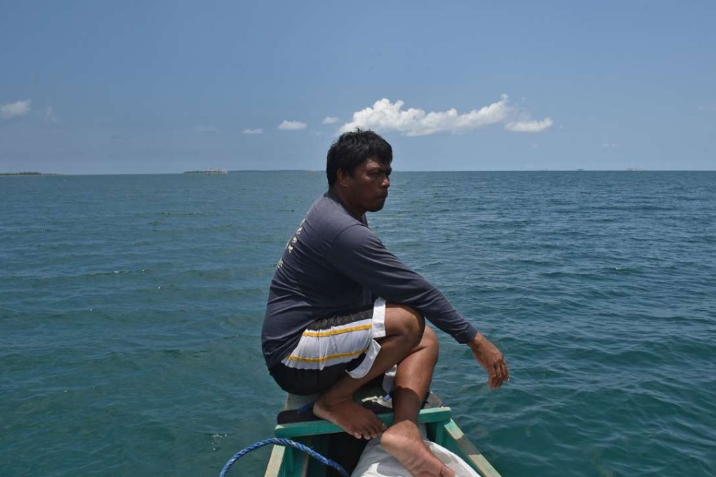 A fisherman anchored at the town of Infanta in the Philippines prepares for an expedition to the disputed Scarborough Shoal. Photo: AFP