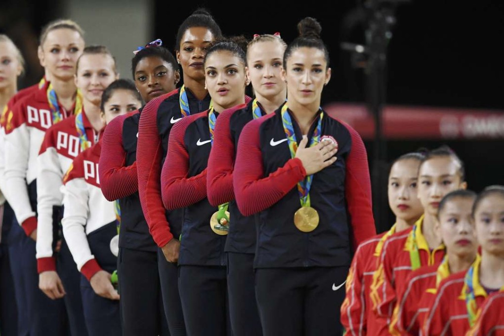 The USA (centre) on the podium after winning the team gymnastics title ahead of Russia (left) and China. Photo: Reuters