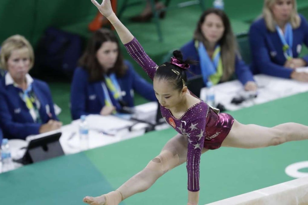 China's Fan Yilin performs on the balance beam during the artistic gymnastics women's team final in Rio. The judging has been blamed for her failure to reach the individual event finals.