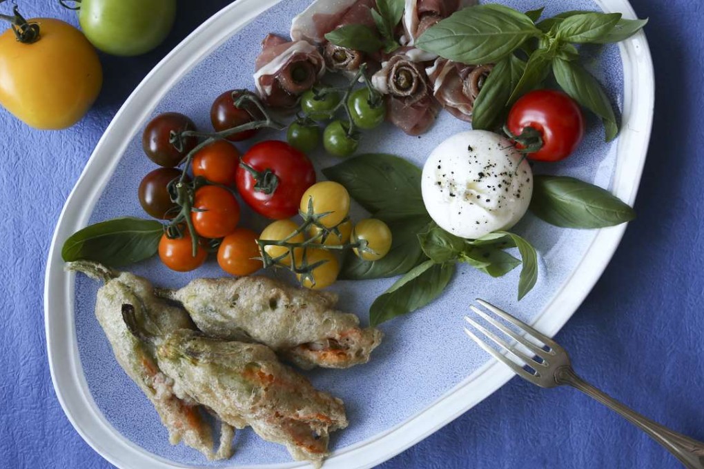 Fried stuffed zucchini blossoms. Photography: Jonathan Wong