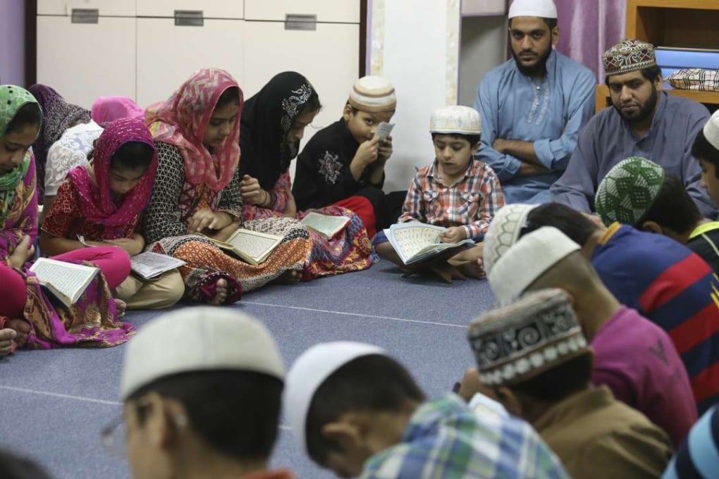 Muslim children packed into a small space in San Po Kong for afternoon prayers. Photo: K.Y. Cheng