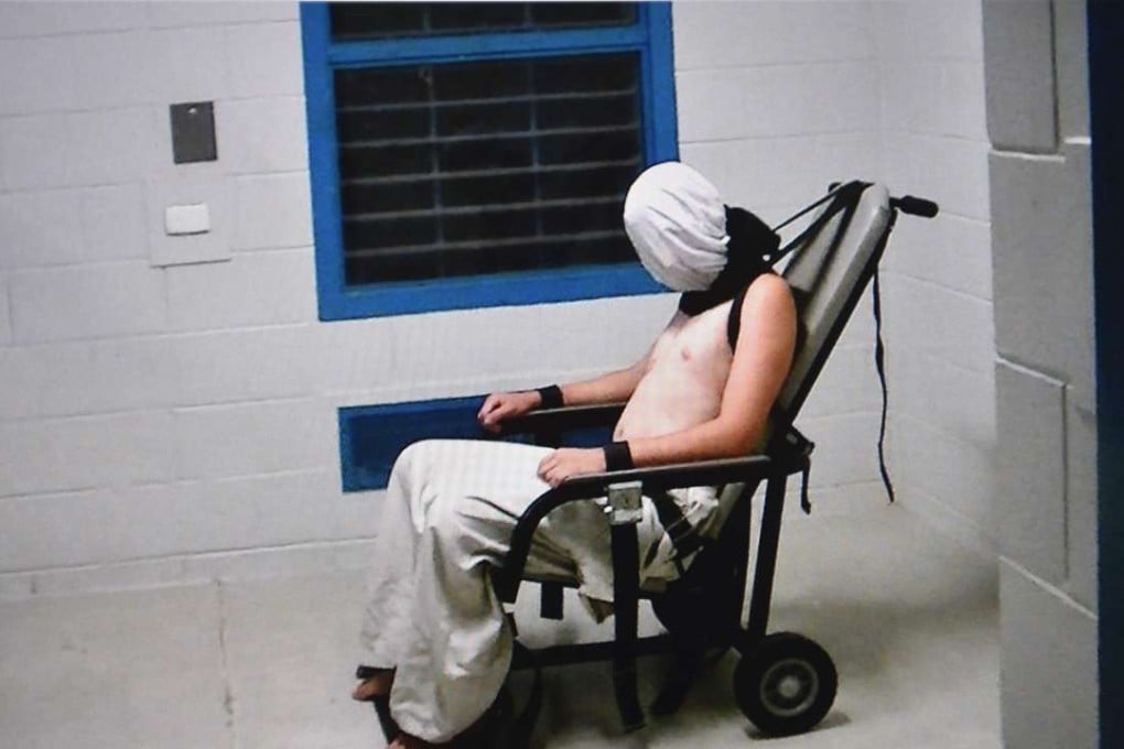 Image from Australian Broadcasting Corporation's Four Corners programme allegedly shows a teenage boy hooded and strapped into a chair at a youth detention centre in Darwin. Photo: AFP