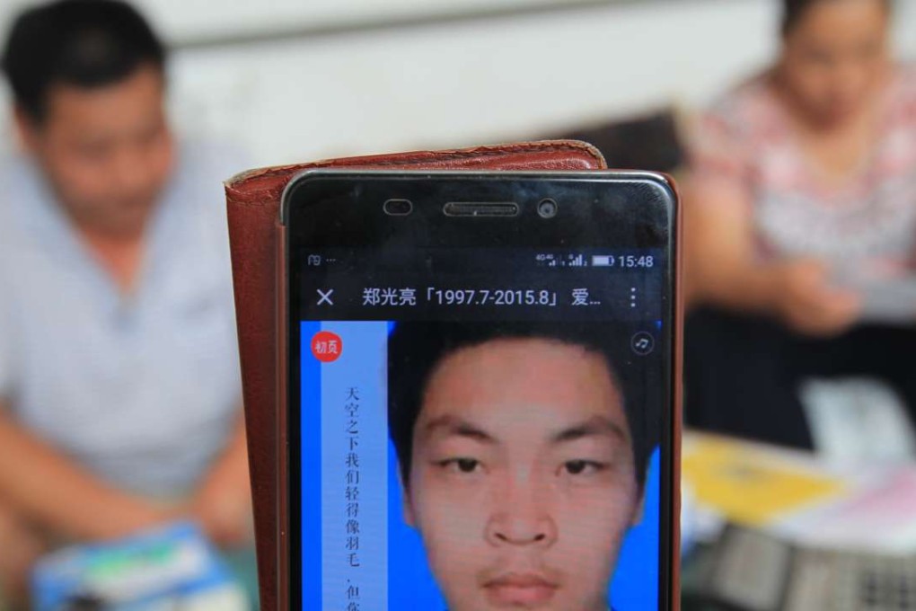 A picture of Zheng Guangliang as his father Zheng Guohua (background, left) and mother Zhang Zhao speak to the South China Morning Post in Qiangxian county, Tianjin. Photo: Simon Song