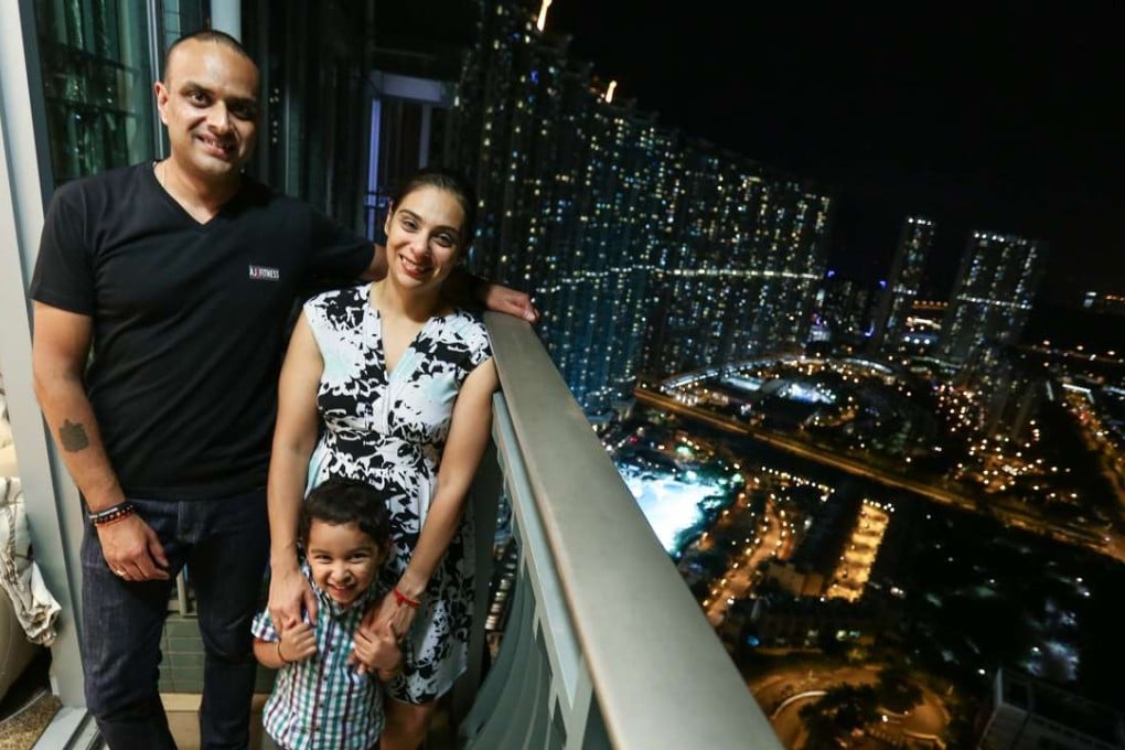 British expats (L to R) Ash Joshi, his son Yash and wife Hina in their home at Caribbean Coast in Tung Chung. 11AUG16 SCMP /Photo: Jonathan Wong