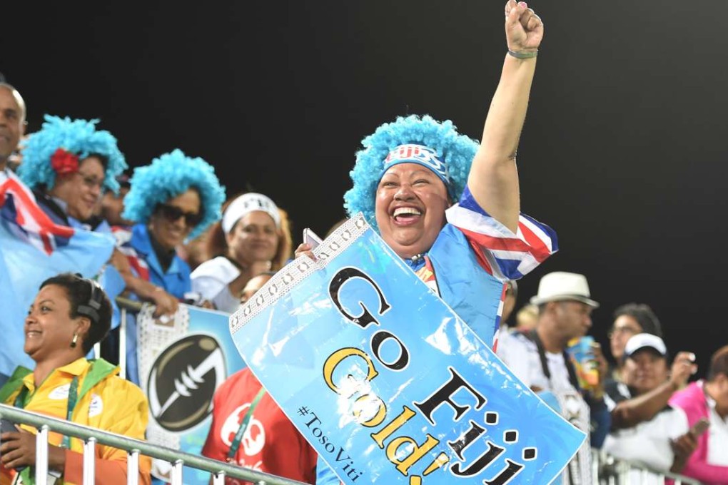 Fans dress up for the men’s sevens gold medal match between Fiji and Great Britain. Photo: Xinhua