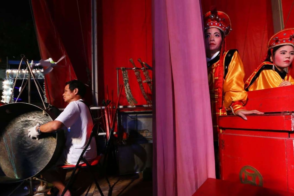 Chinese opera performers prepare for their performance at a makeshift theater at Shau Kei Wan during last year’s Hungry Ghost Festival. Photo: Sam Tsang