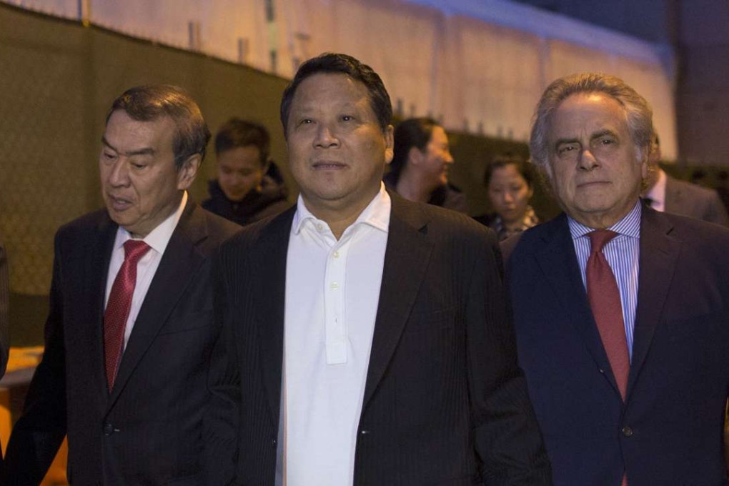 Ng Lap Seng (C), a Macau billionaire real estate developer, exits the Manhattan US District Courthouse with his attorney Benjamin Brafman (R) in New York last October. Prosecutors said Ng used intermediaries to pay John Ashe, a former United Nations General Assembly president and UN ambassador from Antigua and Barbuda, more than US$500,000 to seek support of a UN-sponsored conference centre in the Chinese territory. Photo: Reuters