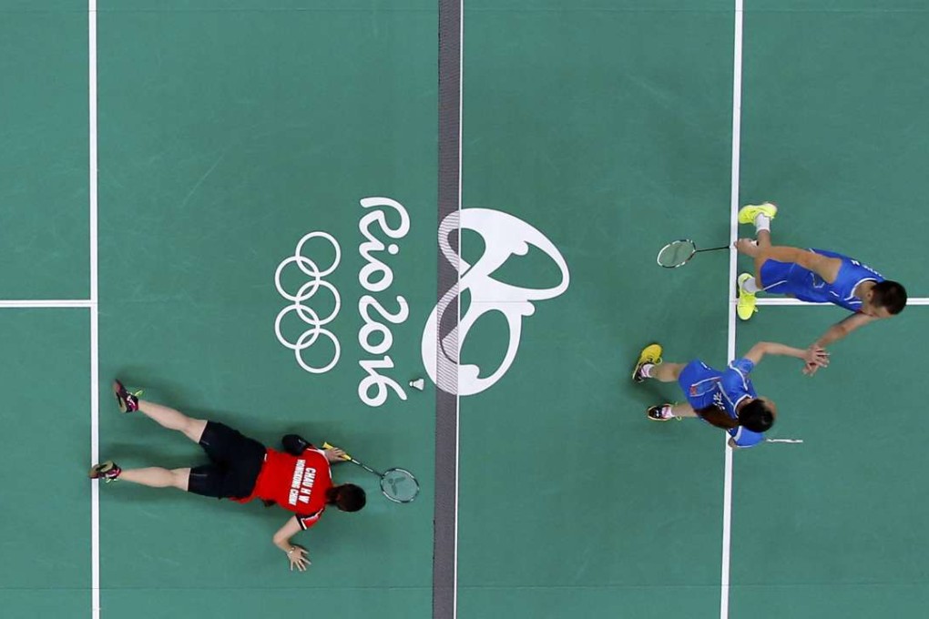 A top view of Cathy Chau in the floor of the court after losing a point to mixed doubles opponents Zhang Nan and Zhao Yunlei of China. Photo: Reuters