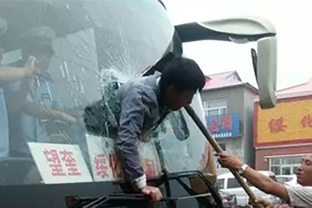 A man was propelled through a bus window when the driver braked suddenly. Photo: SCMP Pictures