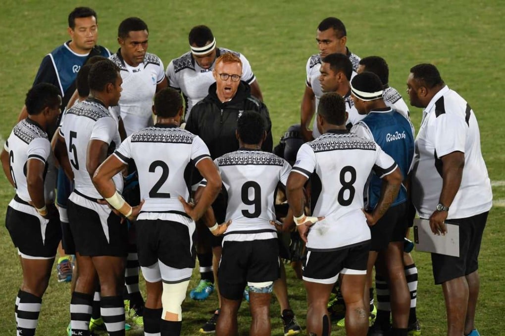 Fiji coach Ben Ryan speaks to his players during the men’s rugby sevens gold medal match between Fiji and Great Britain at Rio 2016 Olympic Games. Photo: AFP