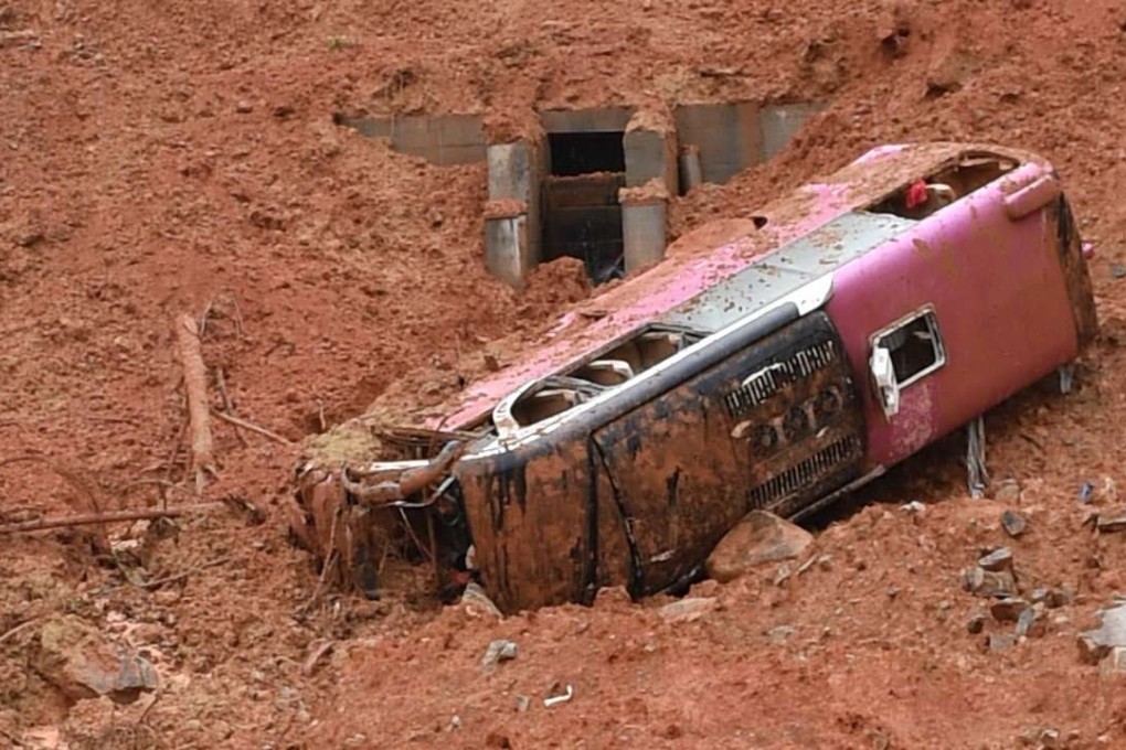 Firefighters took several hours to dig the bus out of the debris and free the survivors through the roof. Photo: Xinhua