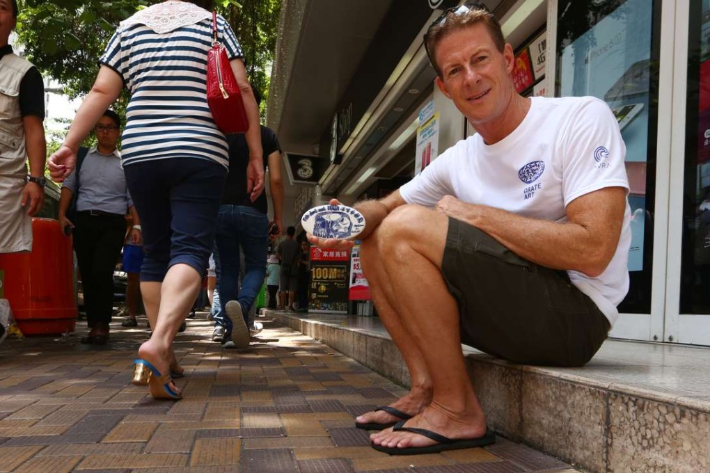 Doug Woodring with his anti-rubbish tiles in Aberdeen, on the south of Hong Kong Island. Photo: Edmond So