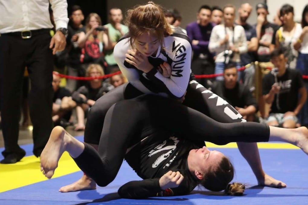 Angela Lee gets to grips with Livia Gluchowska in a grappling contest at the One Championship in Macau. Photos: Edward Wong
