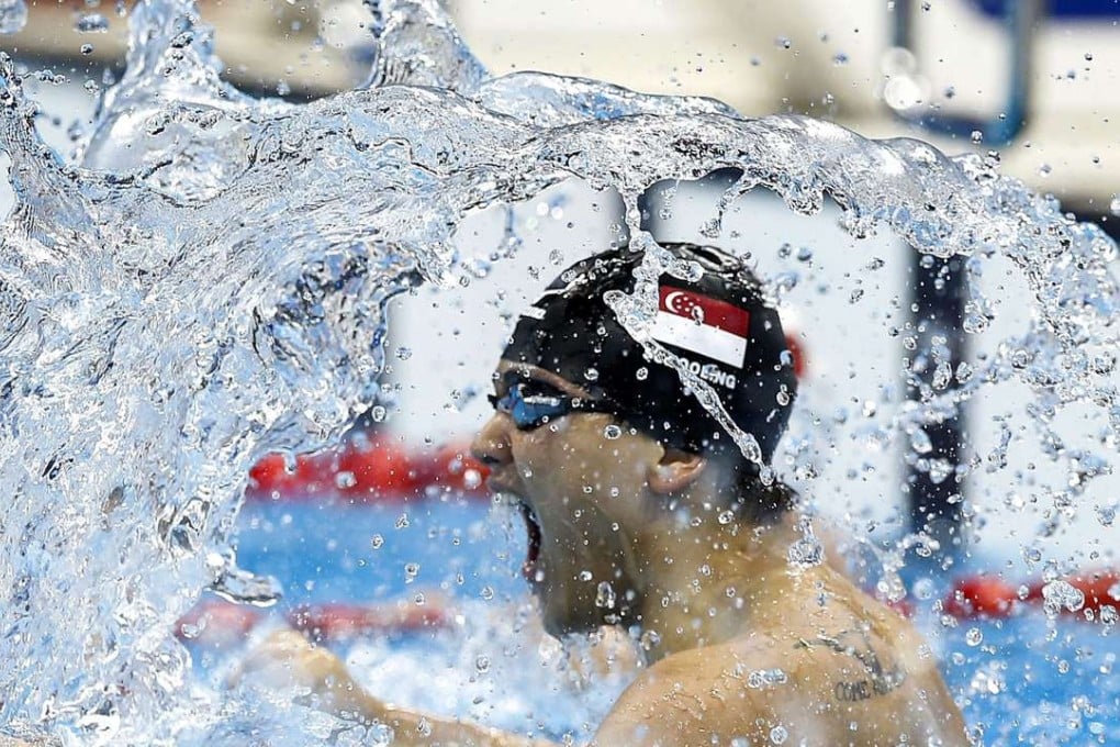 Joseph Schooling of Singapore celebrates after winning the men's 100m butterfly final. Photo: EPA