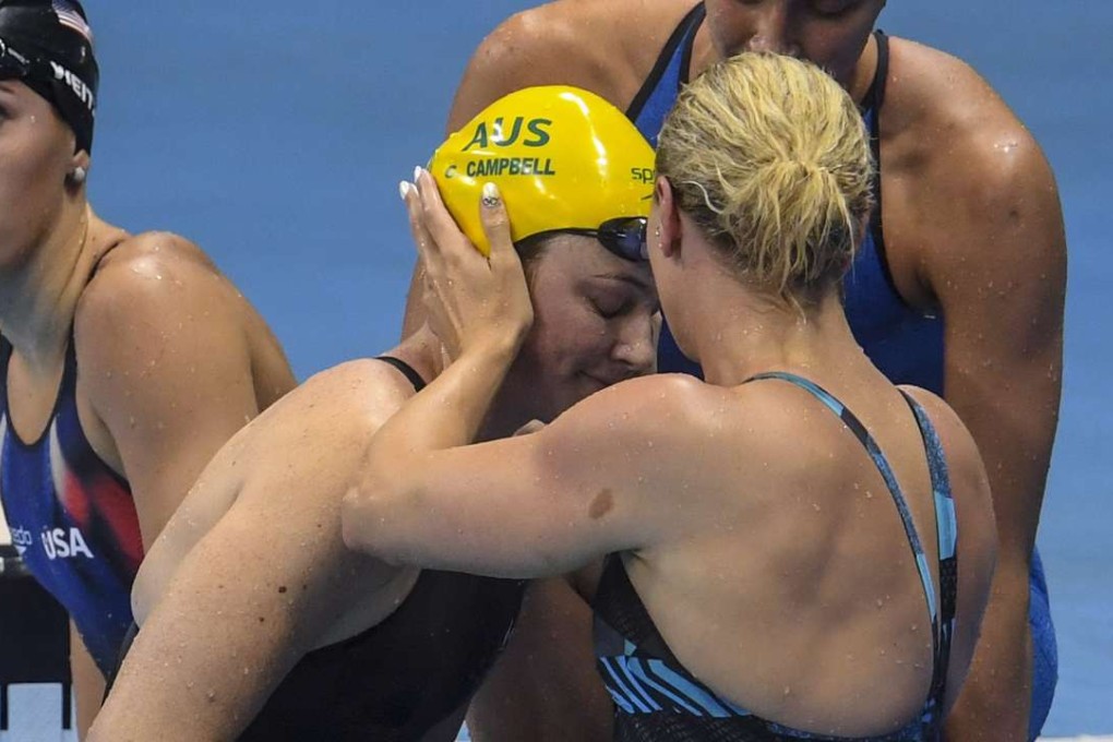 Australia’s Cate Campbell is comforted after finishing sixth in the women’s 100m freestyle final. Photo: EPA