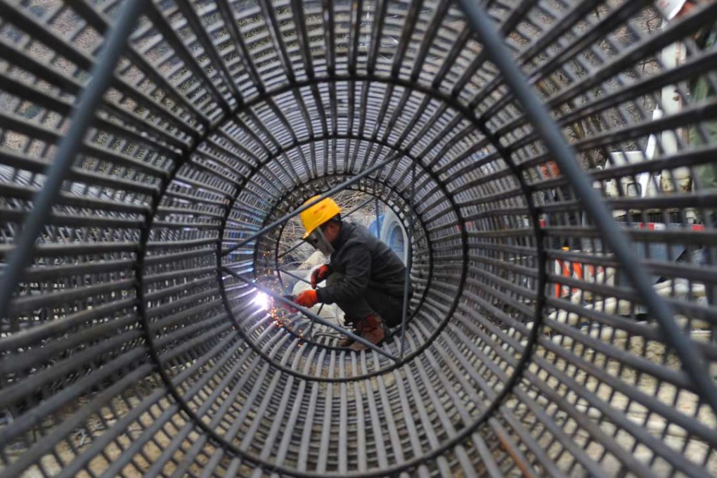 Steel reinforcement bars being welded during construction of the Lhasa-Nyingchi segment of Sichuan-Tibet Railway in Nyingchi, southwest China's Tibet autonomous region. Moody’s is predicting China Railway Group will see a major boost in overseas work, as a result of the government’s Belt and Road initiative. Photo: Xinhua