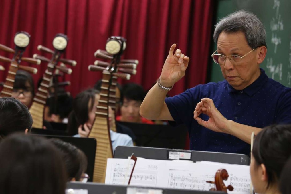 Gordon Siu Kwing-chue, founder of Music For Our Young Foundation (MOY), rehearses at Tin Shui Wai Methodist Primary School with its combined orchestra. Photo: Nora Tam