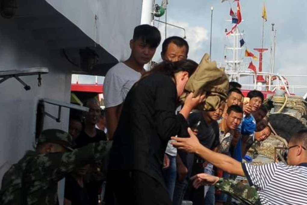 The woman is returned to shore after her ordeal at sea. Photo: SCMP Pictures