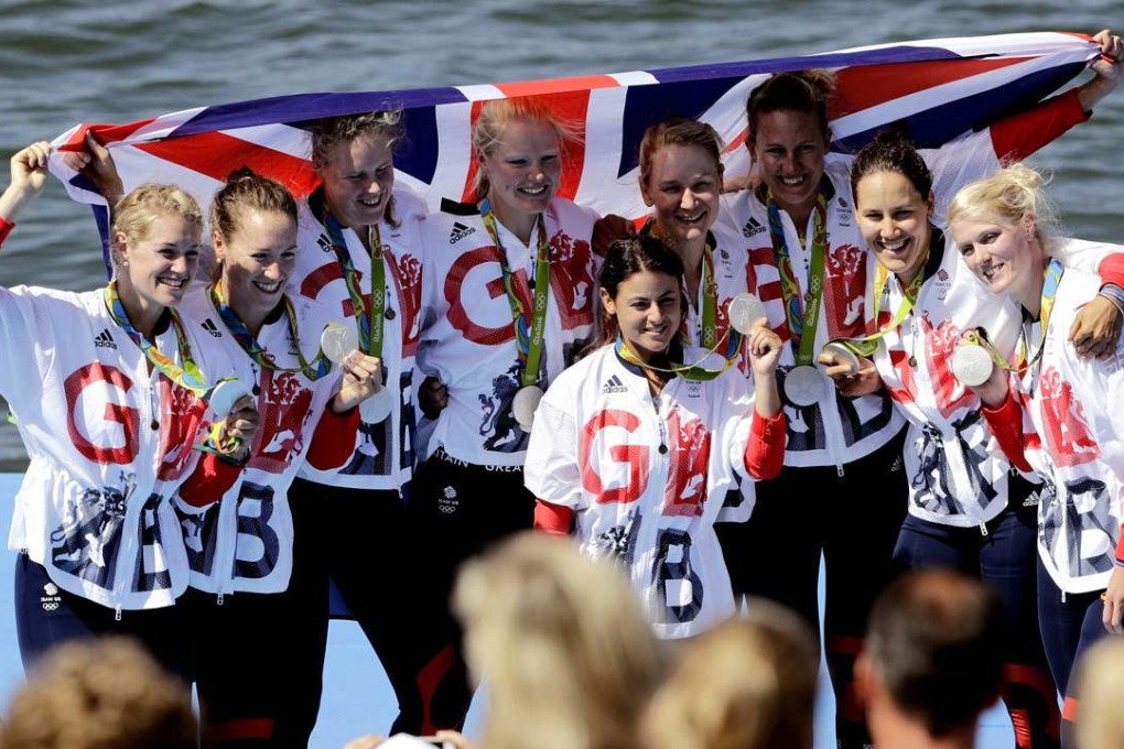 Katie Greves, Melanie Wilson, Frances Houghton, Polly Swann, Jessica Eddie, Olivia Carnegie-Brown, Karen Bennett, Zoe Lee and Zoe de Toledo, of Britain, celebrate after receiving their silver medals in the women’s rowing eights final. Photo: AP