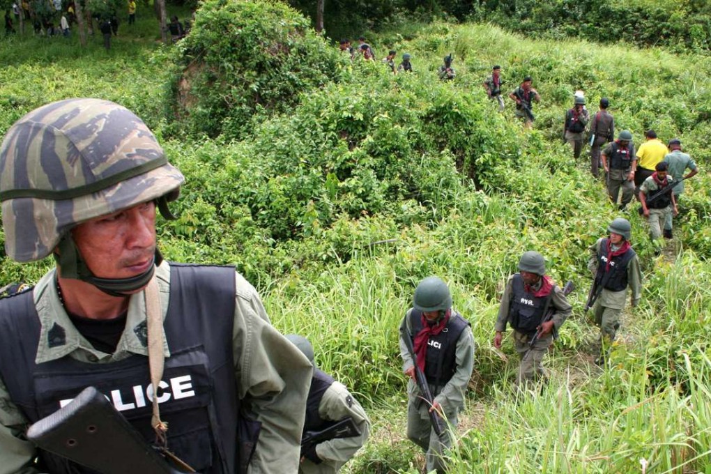 Thai policemen patrol in Pattani. Photo: AP