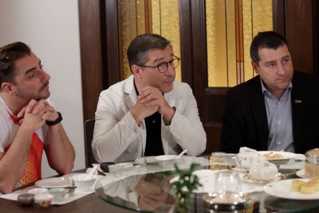 Jordi Roca (left) and his brother Joan (centre) and Josep, of restaurant El Celler de Can Roca in Girona, Spain, sample tea with mooncakes and dim sum at Spring Moon, at The Peninsula Hong Kong. Photo: SCMP
