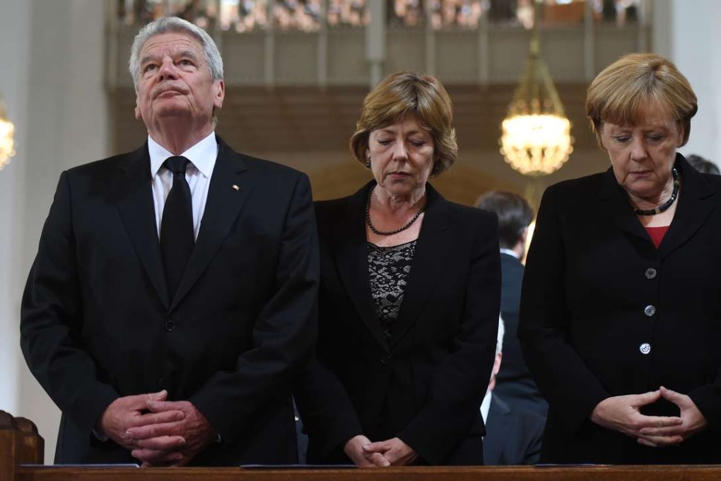 German President Joachim Gauck, his partner Daniela Schadt and German Chancellor Angela Merkel attend a memorial service for the victims of the attack in Munich, southern Germany. Photo: AFP
