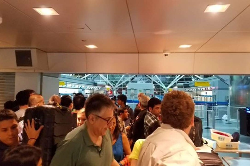A photo taken at JKK airport Sunday afternoon, showing what Twitter user Dam Archer described as "panic at JFK theyre closing the gates at security - possible shooter". Photo: Twitter / Dan Archer