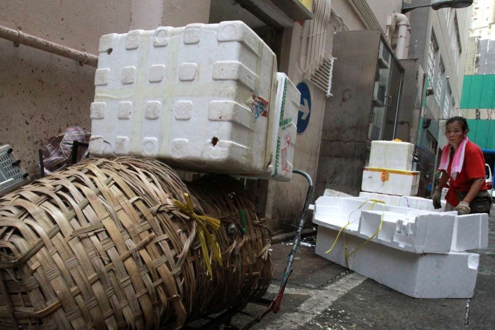 Chan Tong Lane in Wan Chai is seen littered with polystyrene. Photo: SCMP Pictures