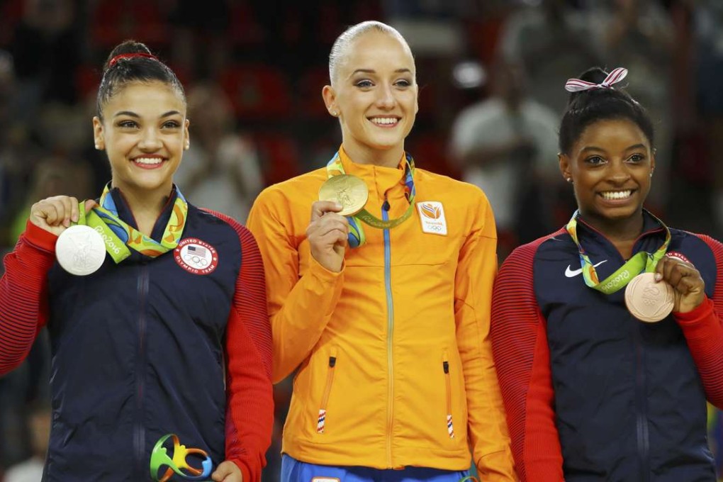Gold medallist Sanne Wevers of Netherlands (C) surprisingly bested Simone Biles of the US, who took bronze. Laurie Hernandez of USA (L) took silver. Photo: Reuters
