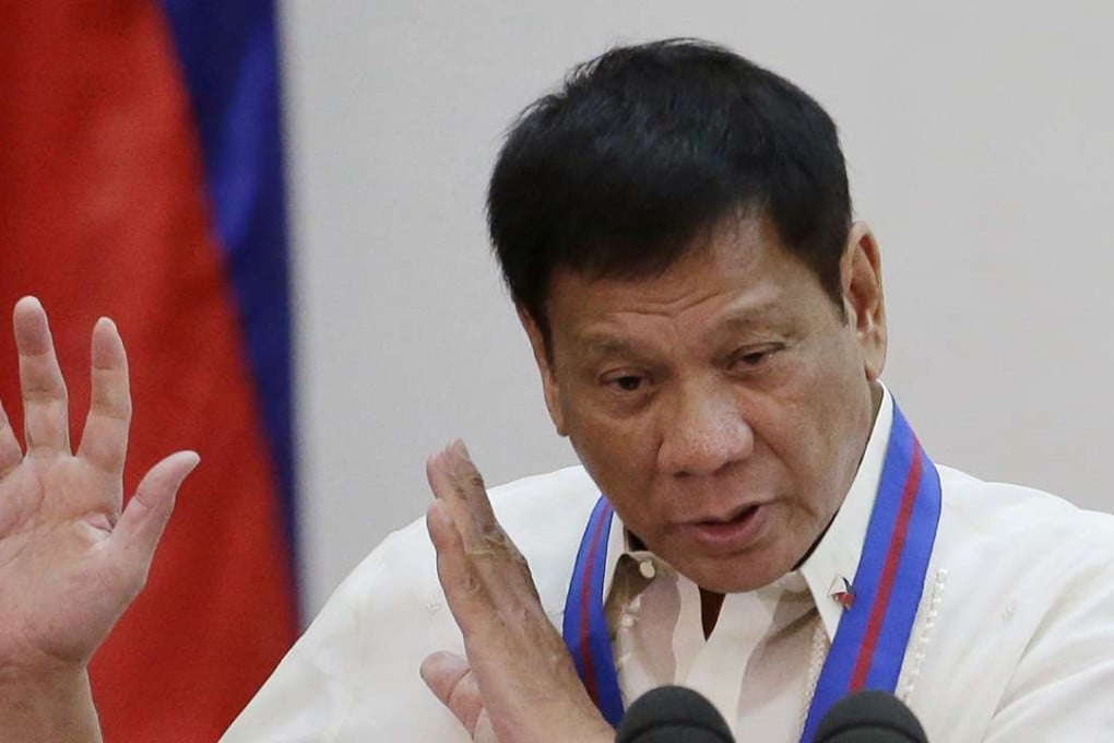 Philippine President Rodrigo Duterte gestures during the "Assumption of Command" of new Police Chief Director General Ronald Dela Rosa at Camp Crame. Photo: AP