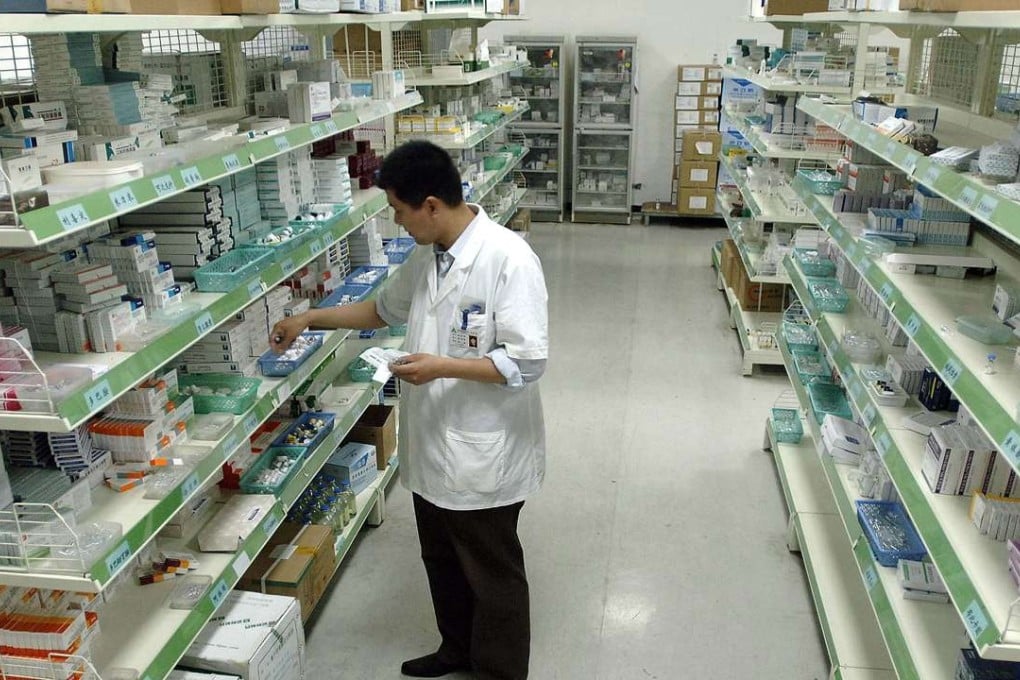 A Chinese pharmacist checks his stock of medicine at a hospital pharmacy in Hefei, central China's Anhui province. The US FDA said Zhejiang Medicine Co may have hid data showing product contamination. Photo: AFP