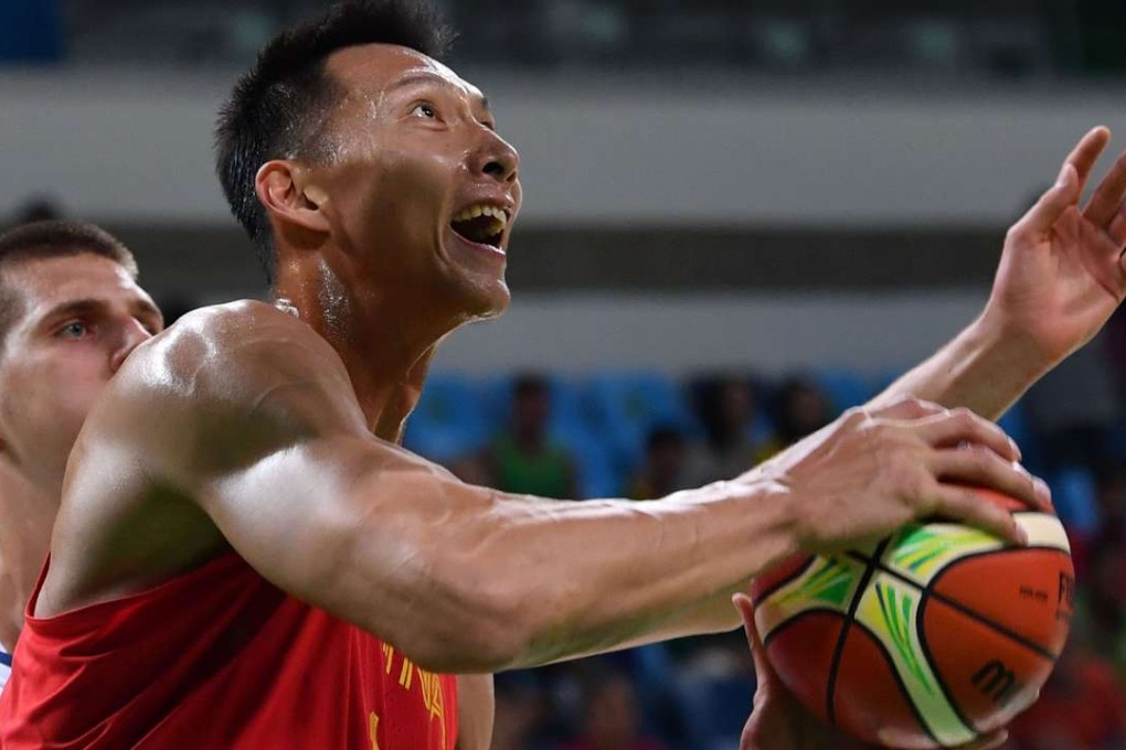 Yi Jianlian prepares to jump for a basket against Serbia in group play at the Olympics in Rio. Photo: AFP