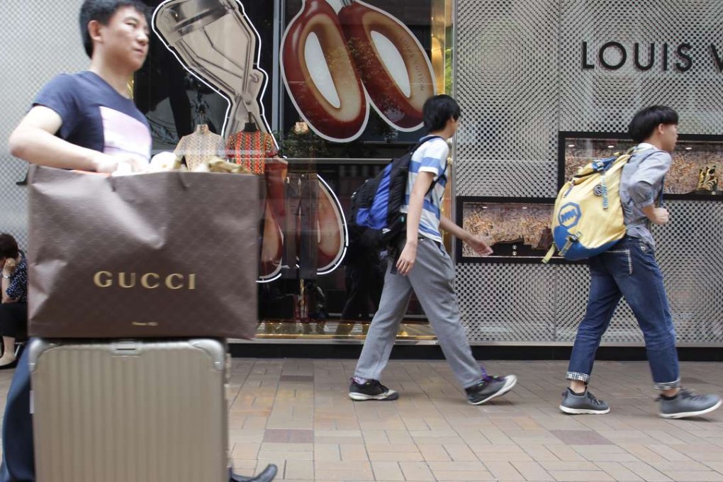 Mainland tourists on Canton Road in Tsim Sha Tsui. Their spending in Hong Kong is still falling back. Photo: Dickson Lee
