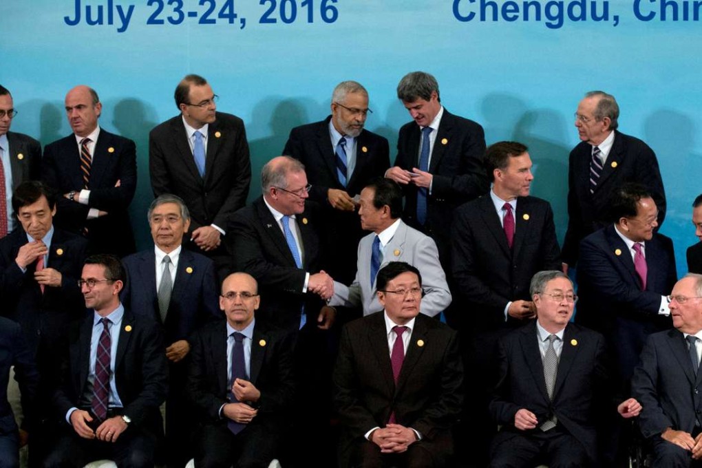 G20 finance ministers and central bank governors prepare for a group photo in Chengdu in China's Sichuan province, July 24, 2016. Photo: Reuters