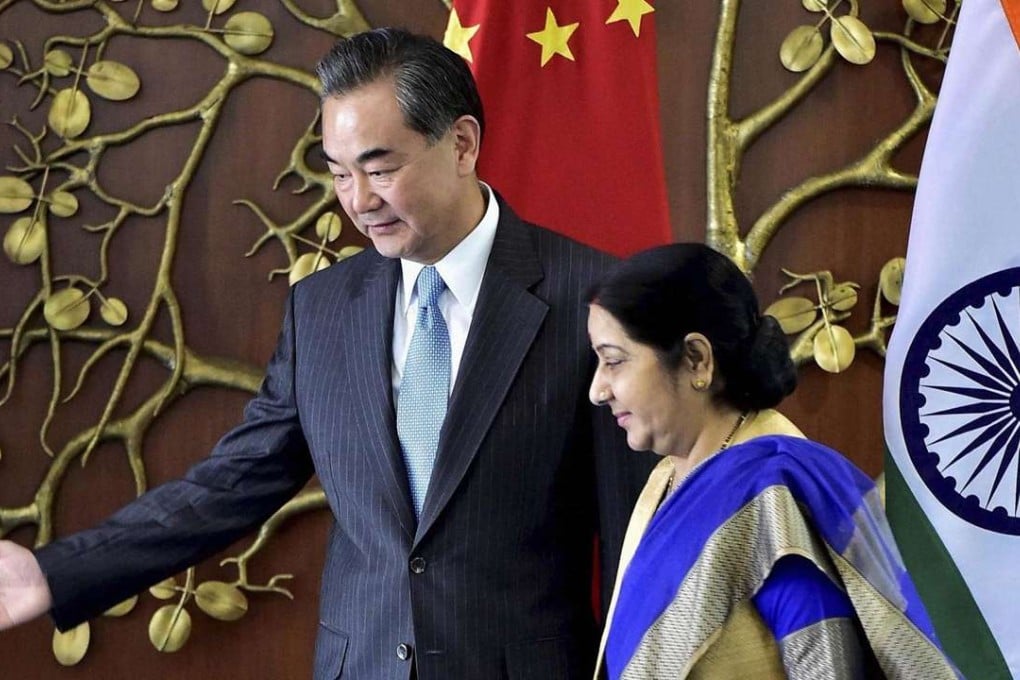 Visiting Foreign Minister Wang Yi and Indian External Affairs Minister Sushma Swaraj arrive for a meeting in New Delhi, India, on August 13. Photo: AP