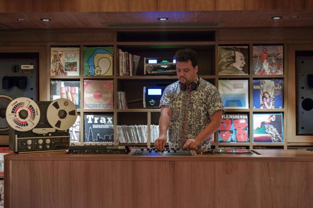 Johnny Hiller (top) DJs at the music room.