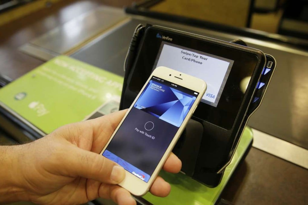 The new Apple Pay mobile payment system lets you use your phone instead of cash or plastic to pay at stores. Photo: AP