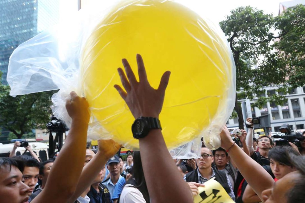 Protesters scuffle with police outside Central Plaza. Photo: Felix Wong
