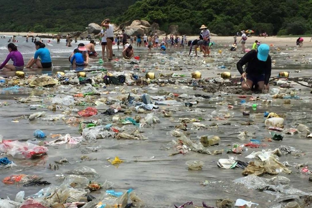 A clean-up operation on Cheung Sha beach, Hong Kong .