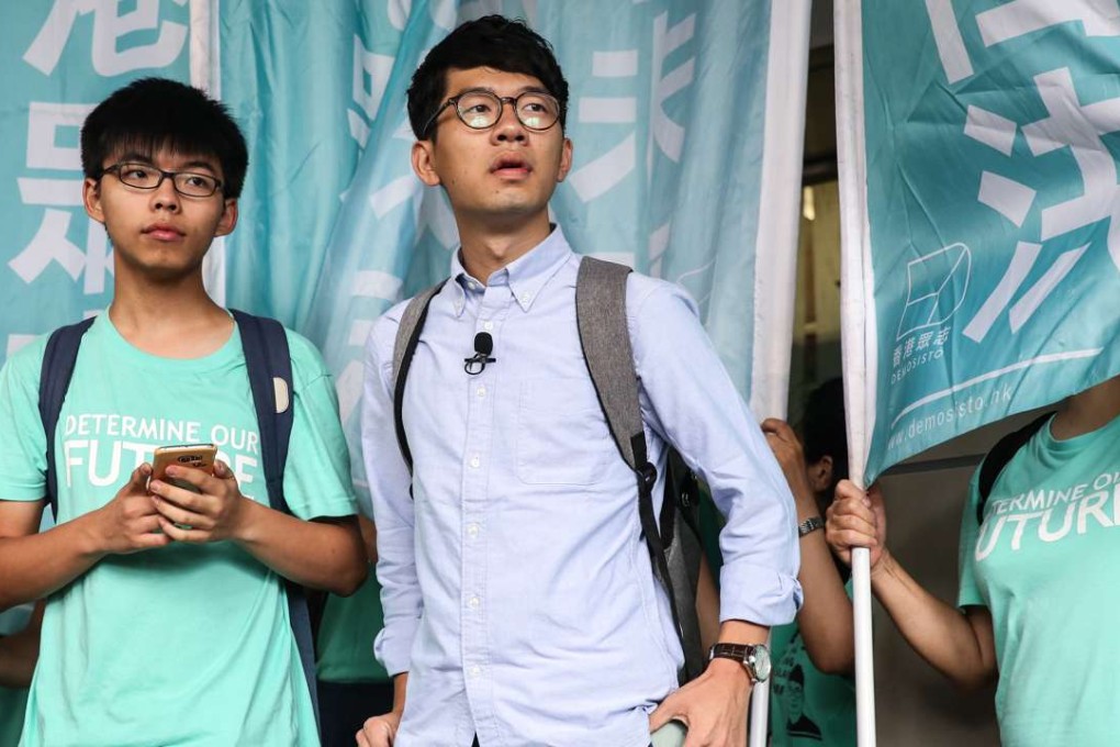 (L to R) Joshua Wong Chi-fung and Nathan Law Kwun-chung outside Eastern Court in Sai Wan Ho. Both are sparred jail over the storming of government headquarters two days before the 2014 Occupy Central protests. 15AUG16 SCMP / Sam Tsang